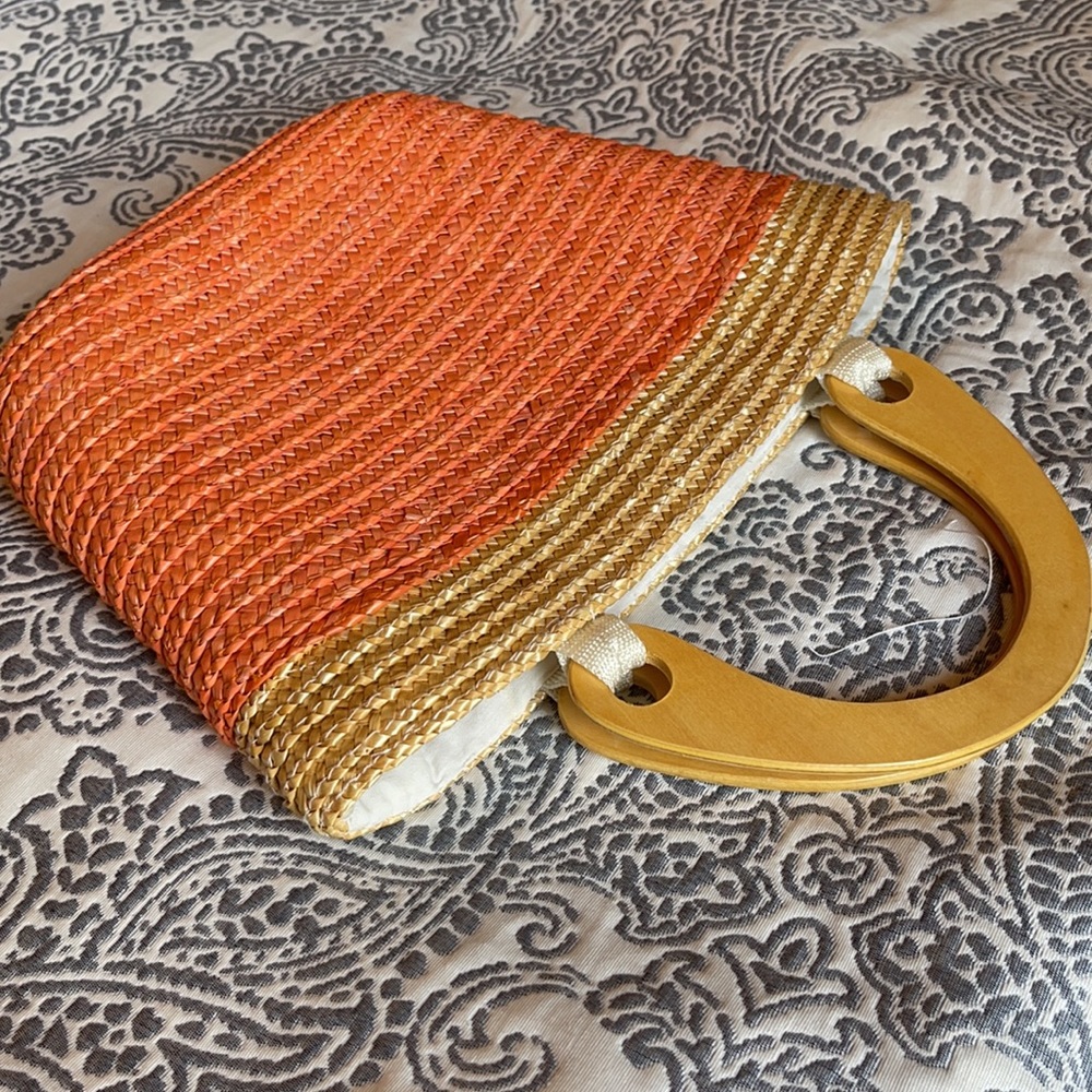 Straw  Woven Tote Bag, with wooden plastic handles, button clipper closure.
